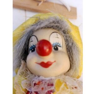 Vintage Porcelain Face Happy Clown on Wood Hanging Swing Yellow Red Sequin Doll